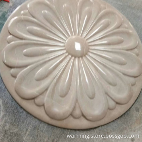 Stone carving on the background of exterior wall